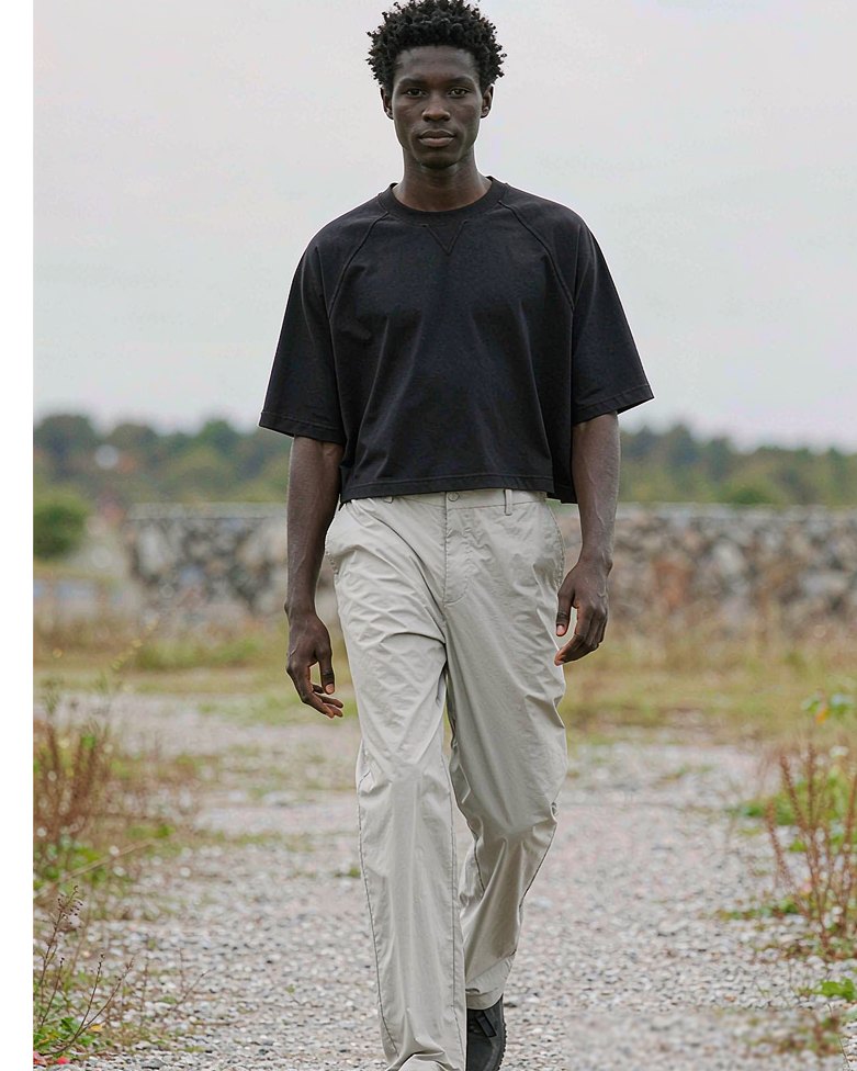 Cropped Tee in Black worn by a model