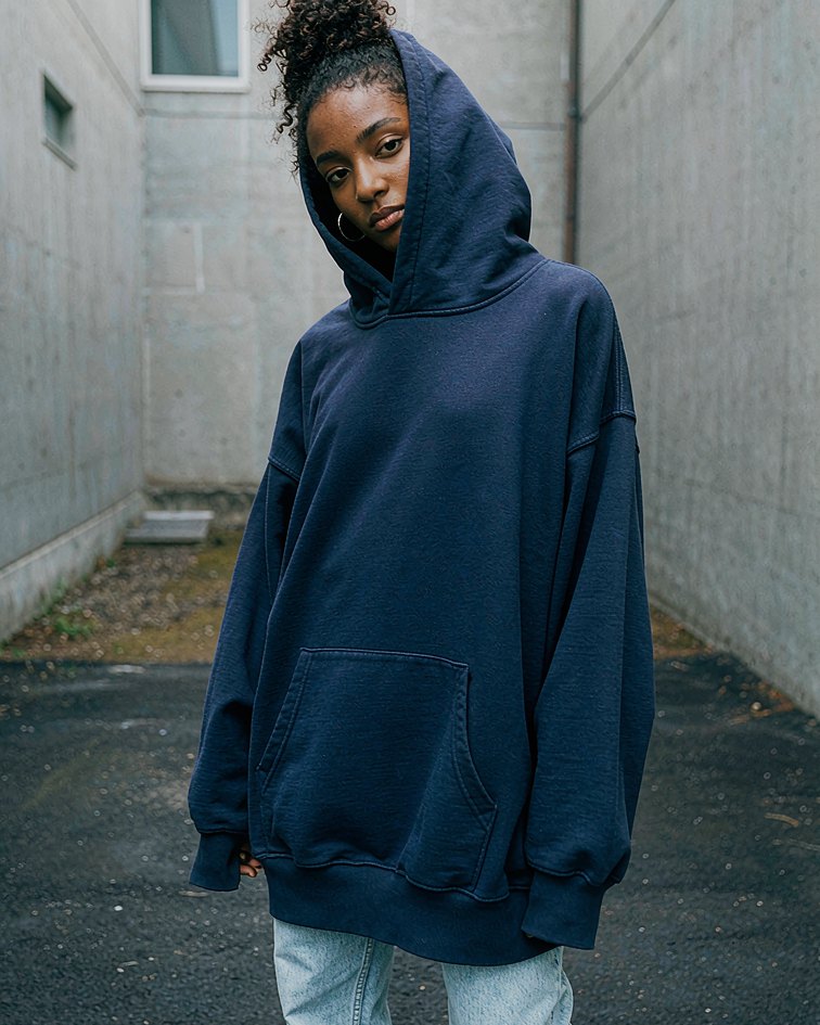 Heavy Hoodie in Navy worn by a model